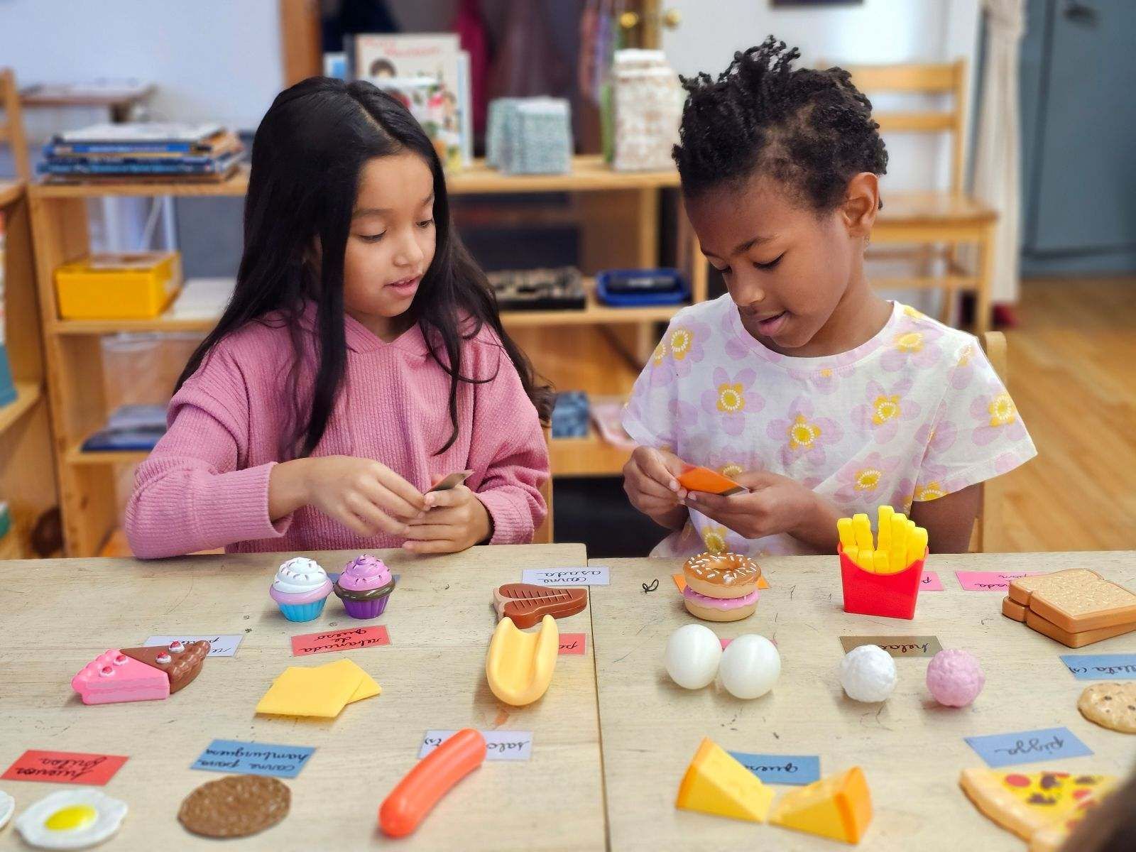 montessori children working with spanish activity