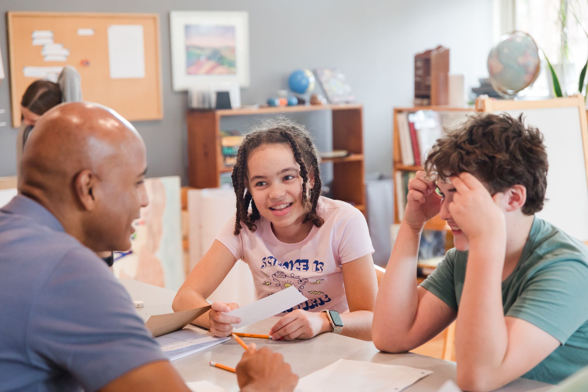 montessori children with guide inside the classroom