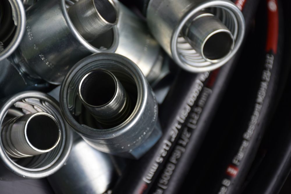 A Bunch of Metal Pipes Are Stacked on Top of Each Other — Alice Hosetech & Industrial Supplies in Ciccone, NT