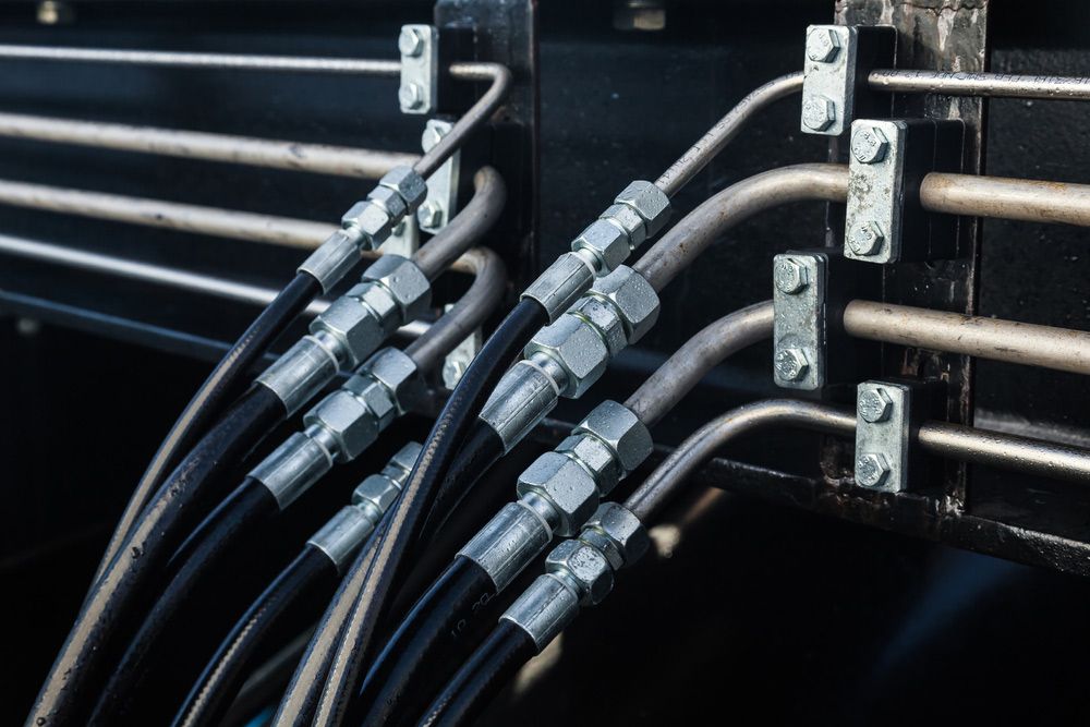 A Bunch of Hydraulic Hoses Are Connected to A Machine — Alice Hosetech & Industrial Supplies in Ciccone, NT