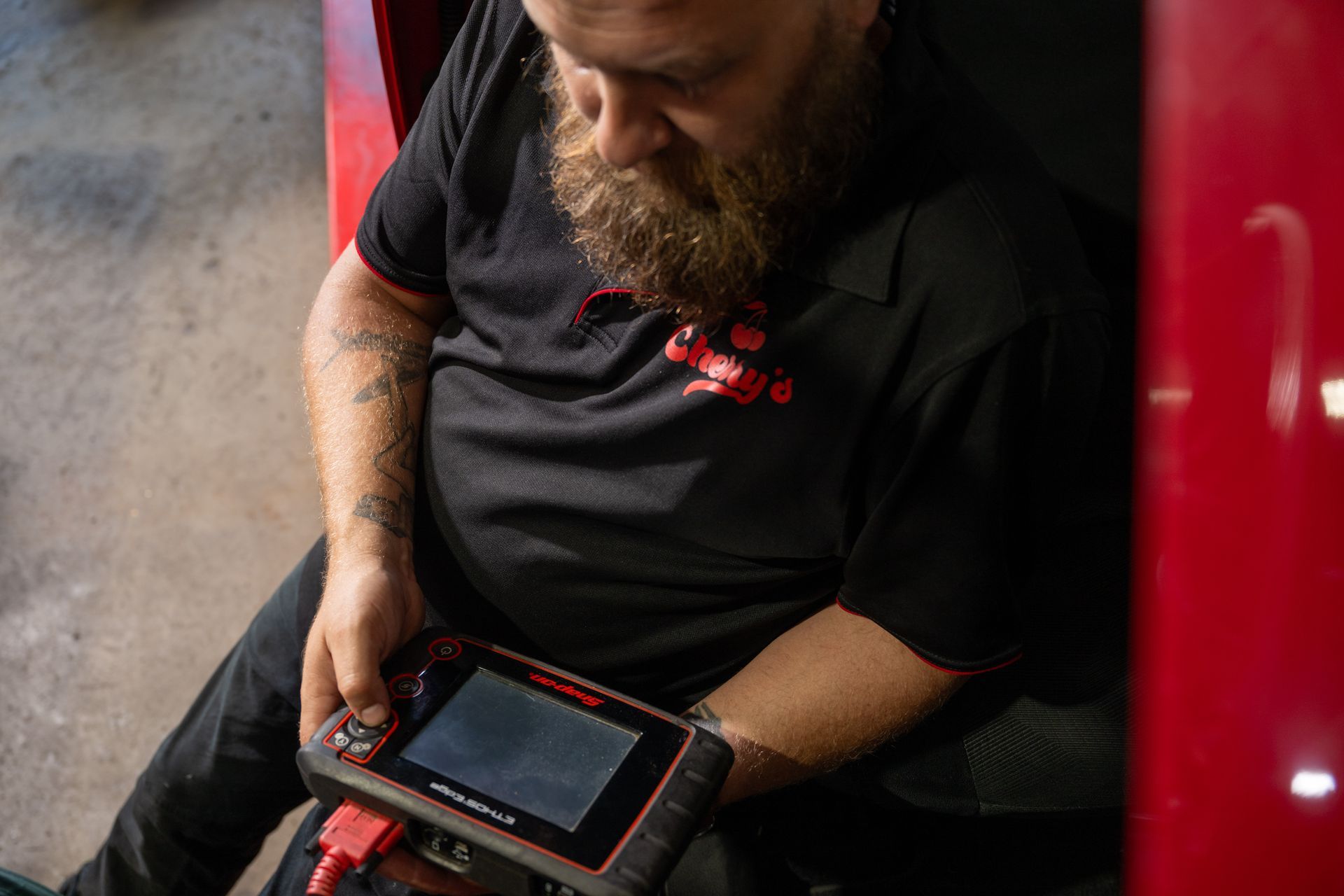 Mechanic Using Car Diagnosis Tools To Check The Car For Maintenance — Cherry's Automotive Repairs In Maitland, NSW