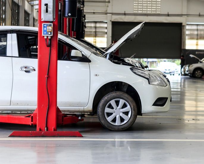 White Car Repair In Auto Repair Shop With Open Hood — Cherry's Automotive Repairs In Maitland NSW