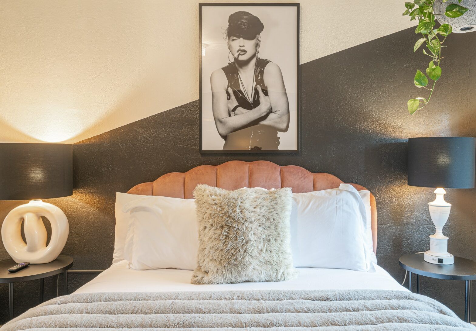 There is a bed and a couch in the living room.