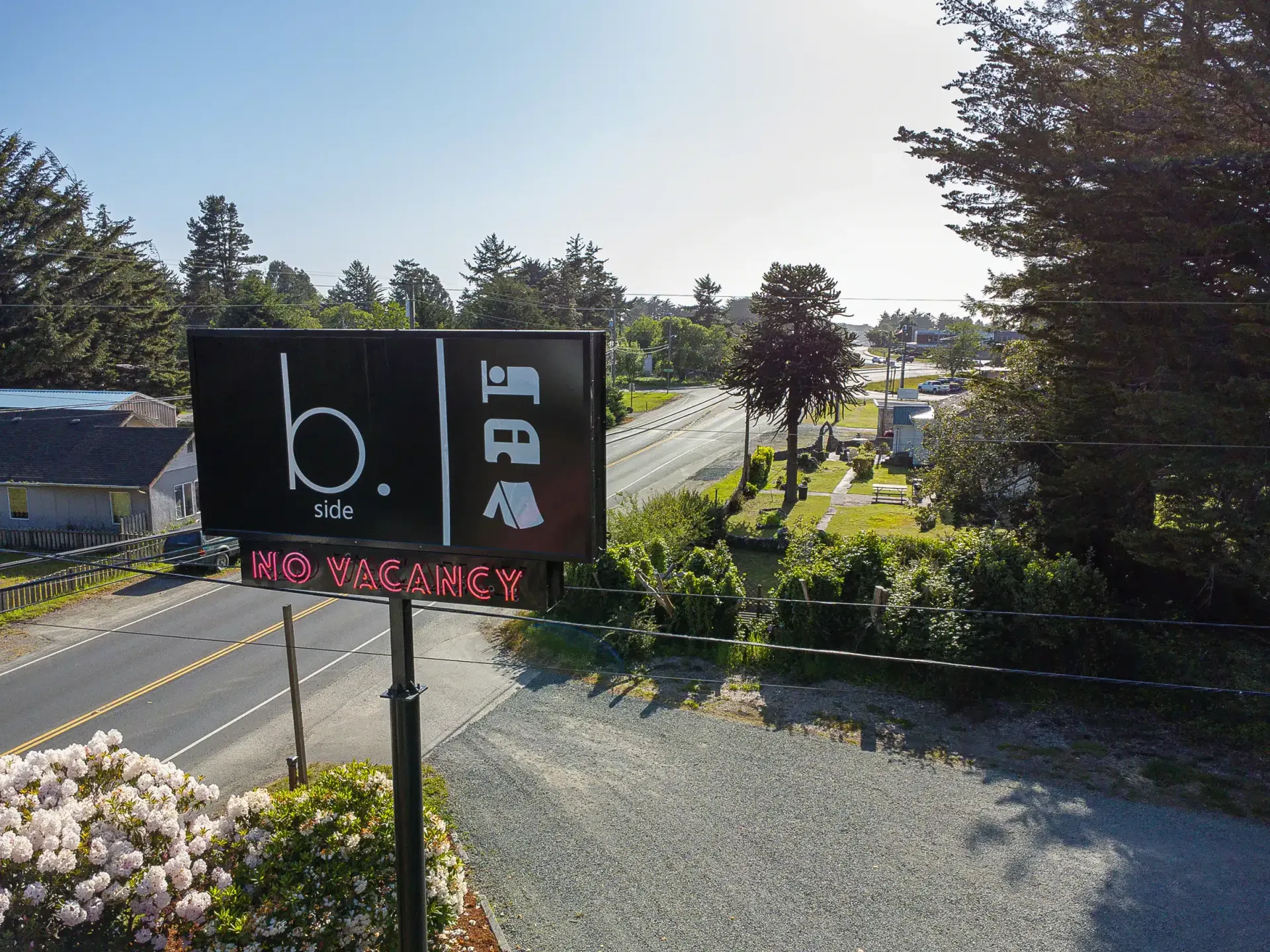 A sign that says b. is on the side of a road