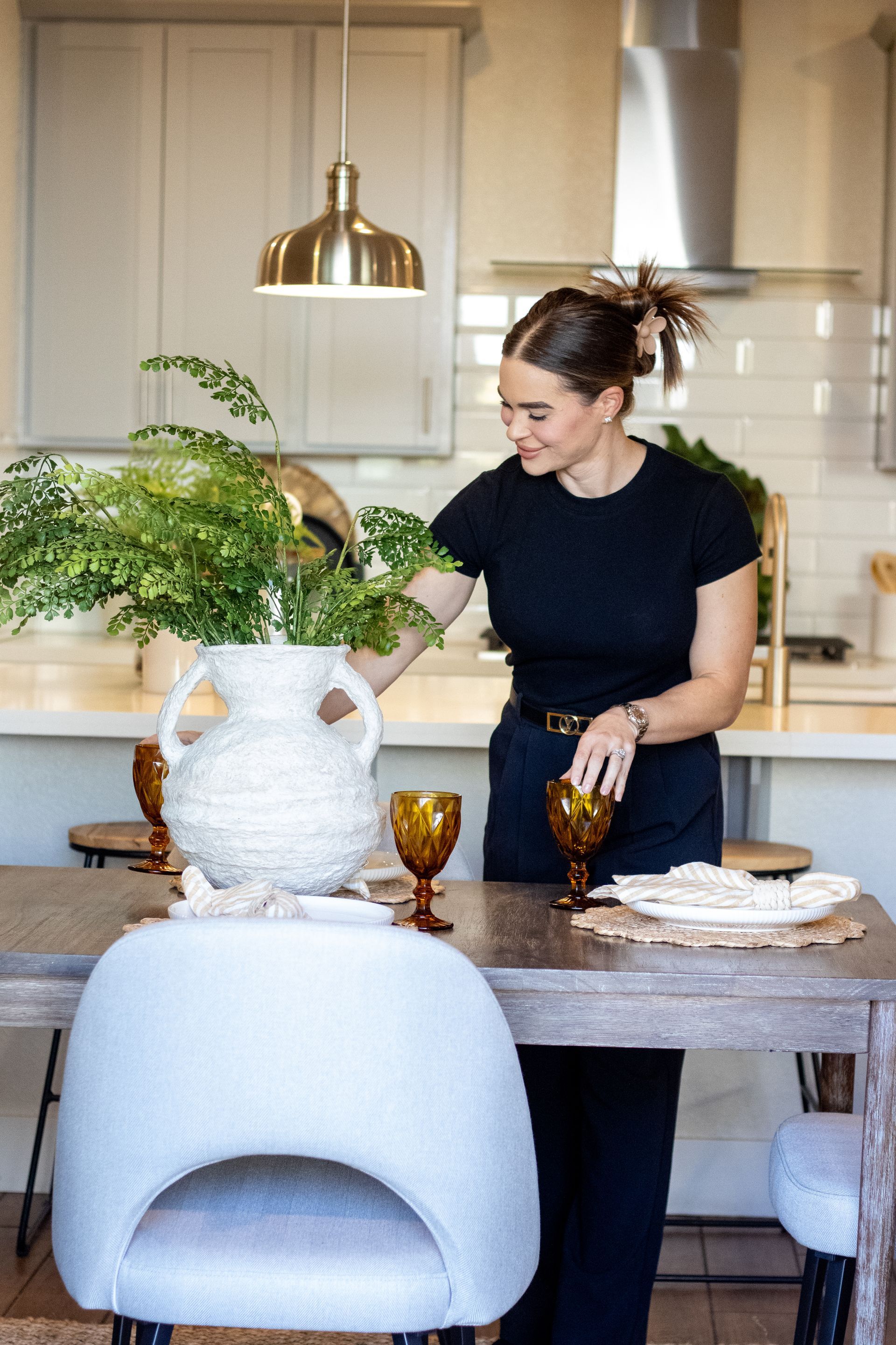 Business card and glasses on floral fabric.