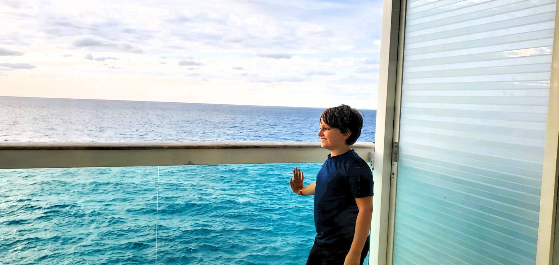 A group of children splashing in the water at the beach.