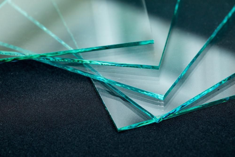 Close Up of a Stack of Clear Glass Pieces on a Black Surface — Glass & Window Centre, Dubbo, NSW