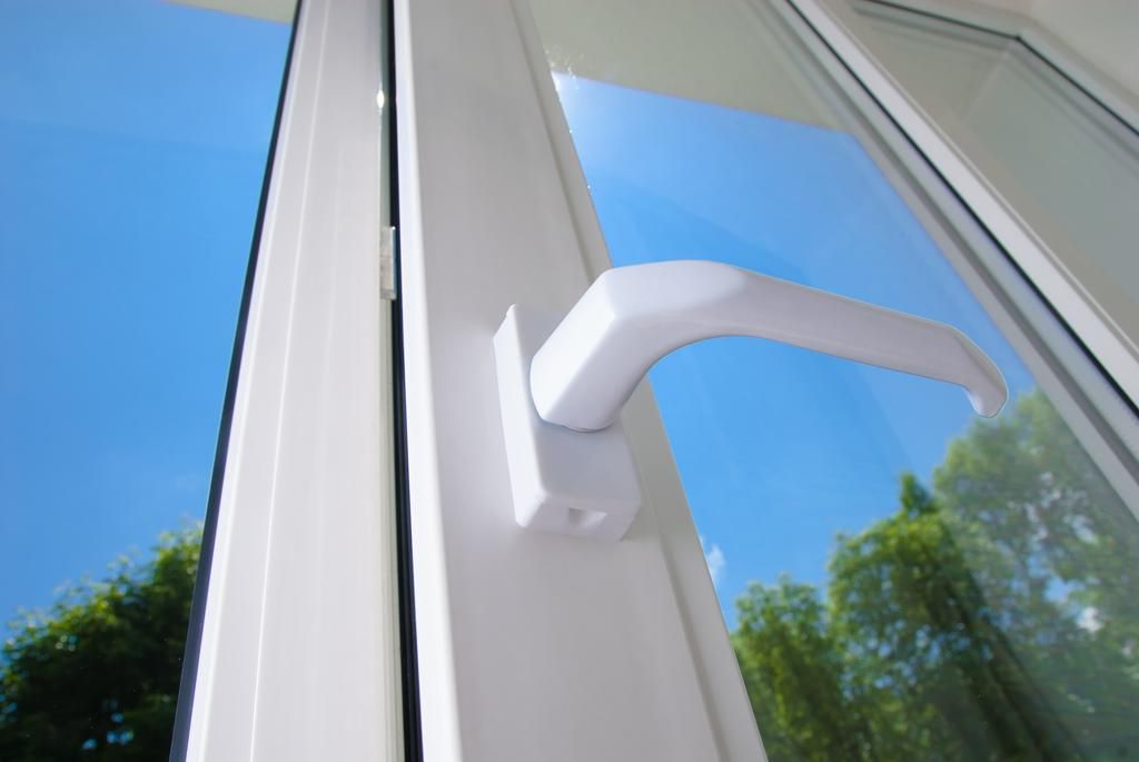 White Plastic Window With a White Handle and a Blue Sky Behind It — Glass & Window Centre, Dubbo, NSW