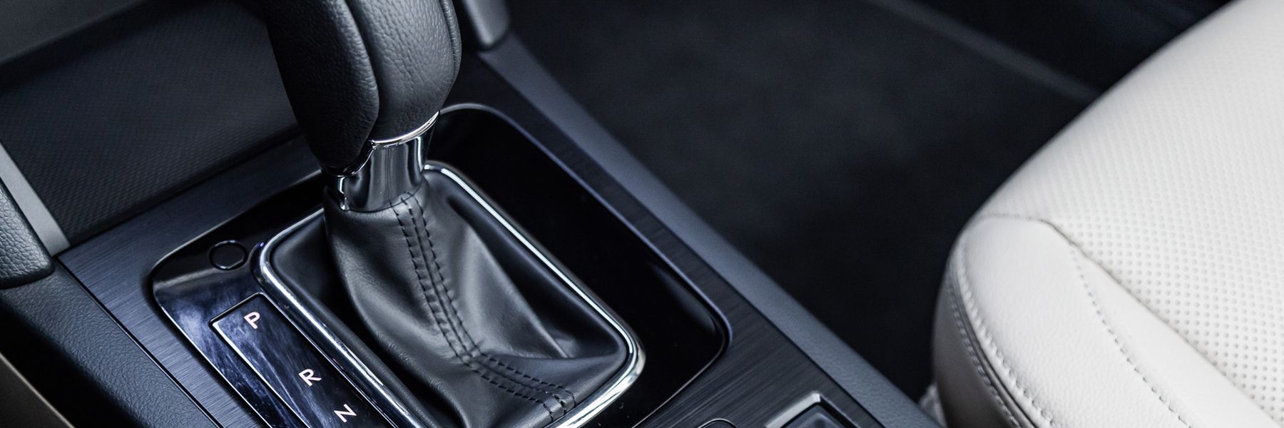 A close up of a shifter in a car.