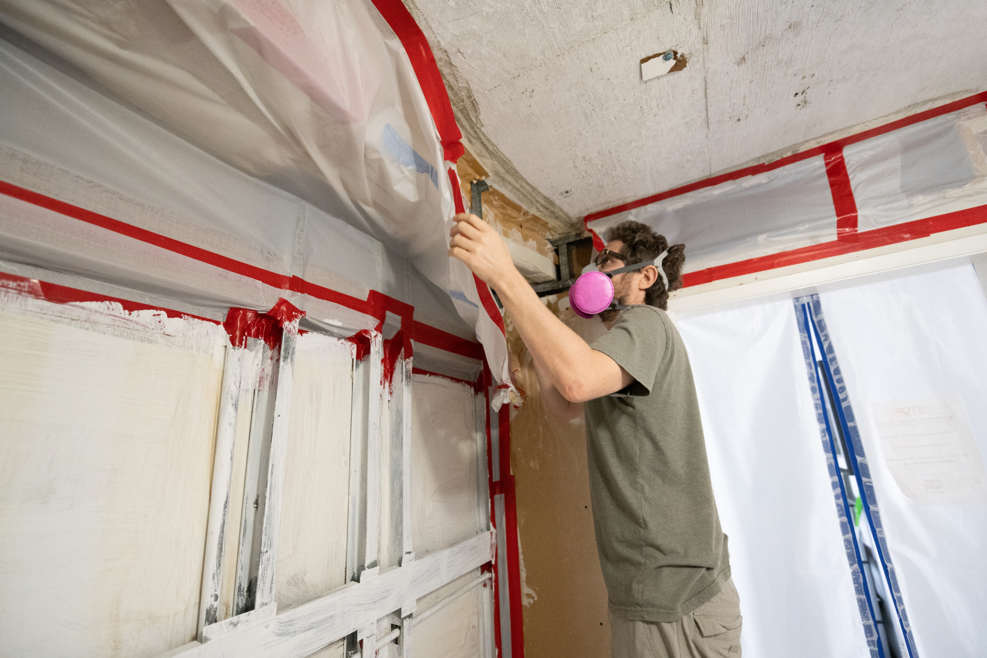 A man working on restoring a water damaged home
