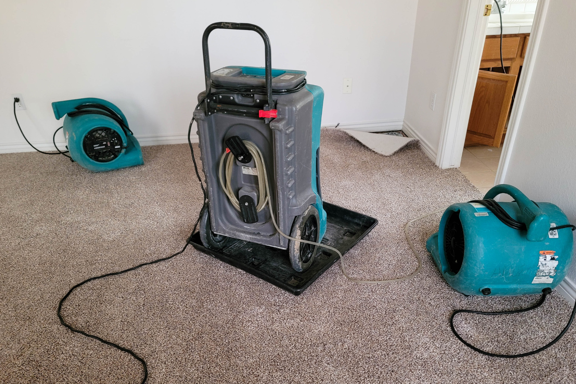 Dehumidifiers in a flooded room.