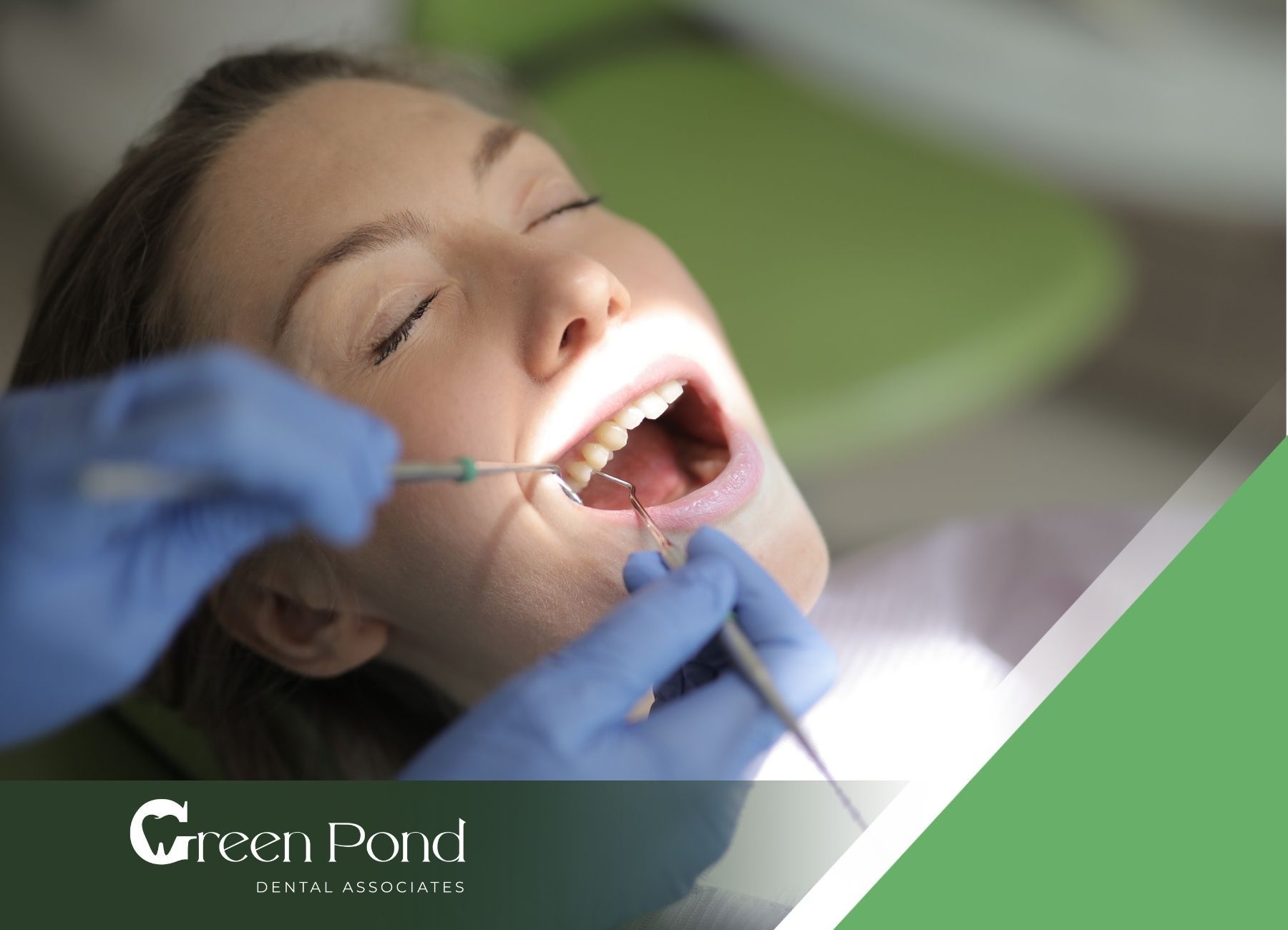 A woman is getting her teeth examined by a dentist.