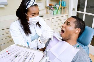 Dentist examining patient - general dentistry in Gurnee, IL