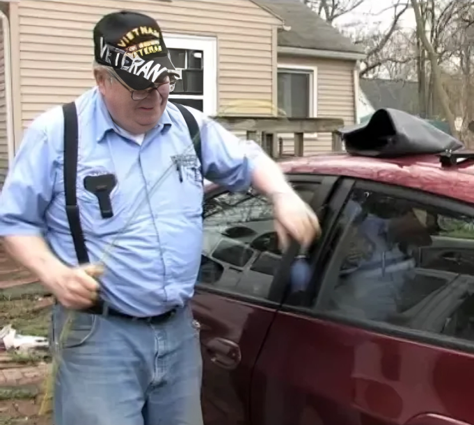 A man wearing a hat that says veteran on it