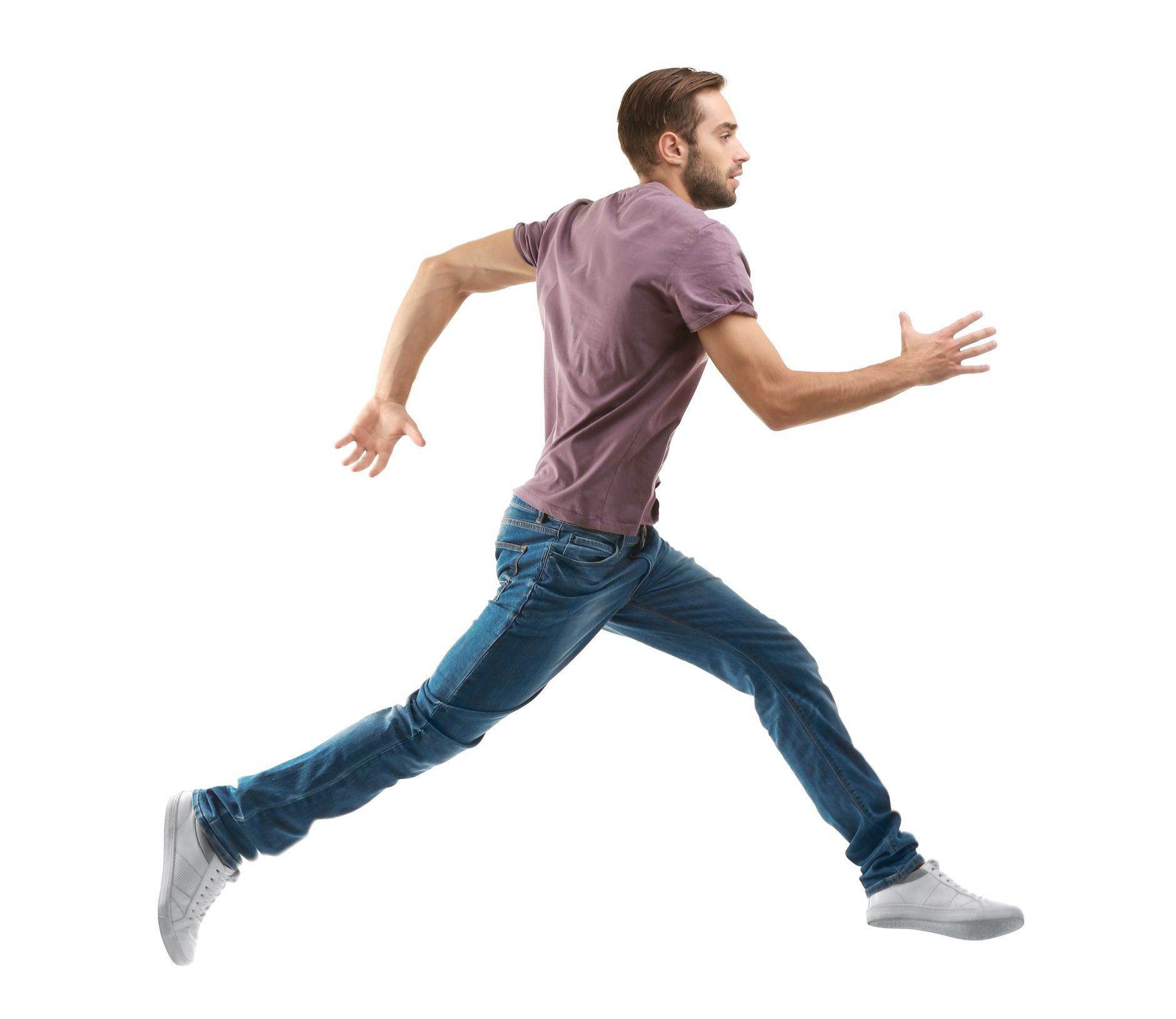 A man in a purple shirt and blue jeans is running on a white background.