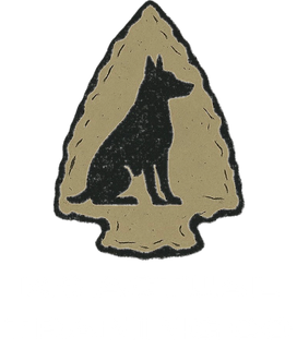 A black silhouette of a sitting dog centered on a tan, textured arrowhead shape with a thick black outline.