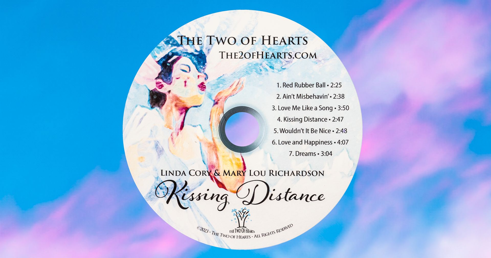 a cd label for the two of hearts kissing distance