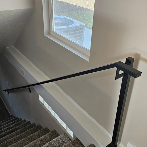 a black handrail fabricated and installed by 83MetalCraft, LLC in Star Idaho