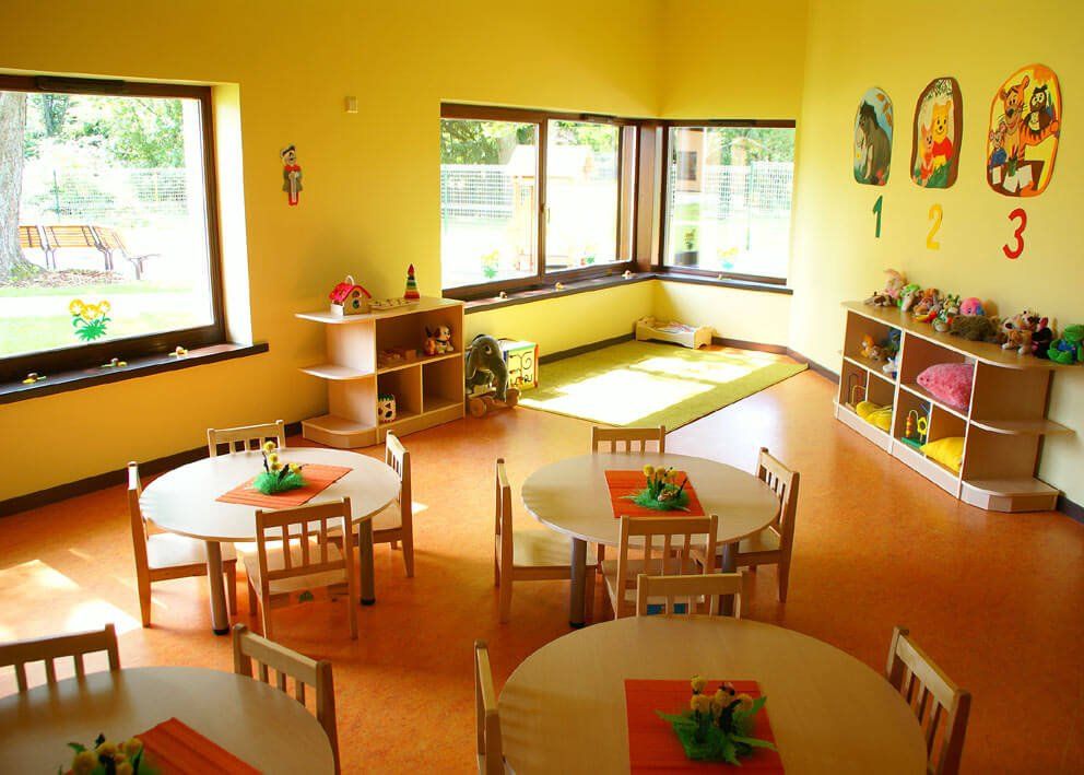 Kindergarten interior with tables and chairs