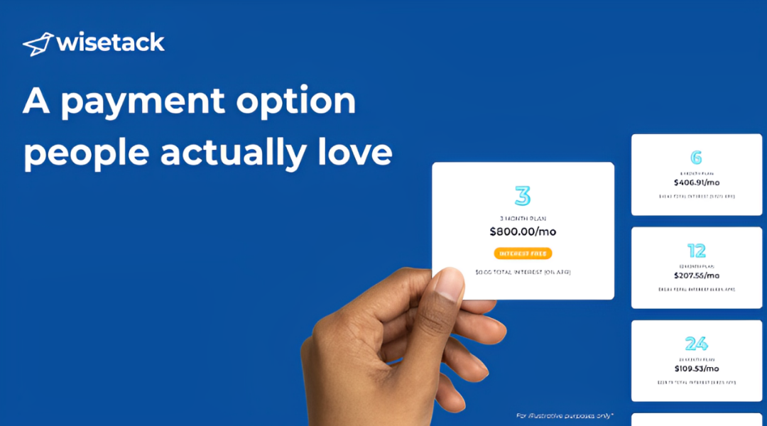 A person is holding a card in front of a blue background that says 