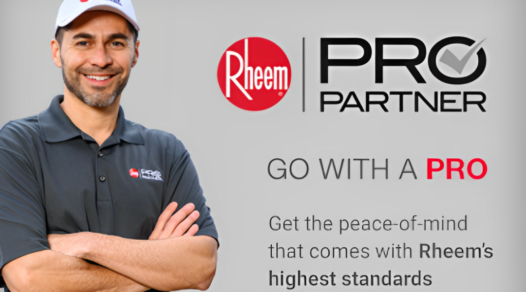 A man is standing with his arms crossed in front of a sign that says pro partner