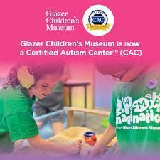 Two children wearing green shirts at Glazer Children's Museum, now a Certified Autism Center.