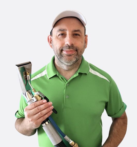 Man in Green Shirt, White Cap, Holding a Carpet Cleaning Tool — Totally Green Cleaning Solutions in Kambah, ACT