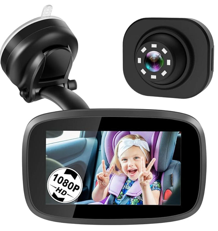 A car camera with a child in a car seat on the screen.