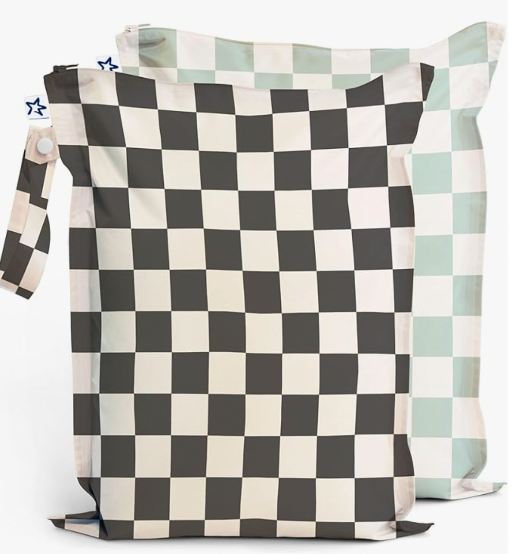 A black and white checkered pillow with a handle