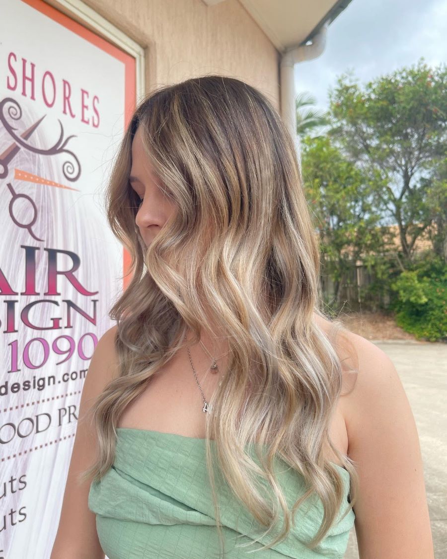 A Woman With Long Blonde Hair — Fraser Shores Hair Design in Fraser Coast, QLD