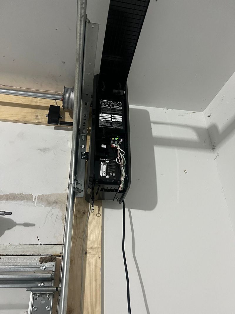 A close up of a garage door opener in a garage.