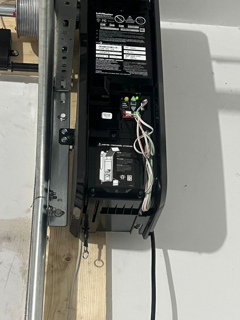 A close up of a garage door opener on a wall.