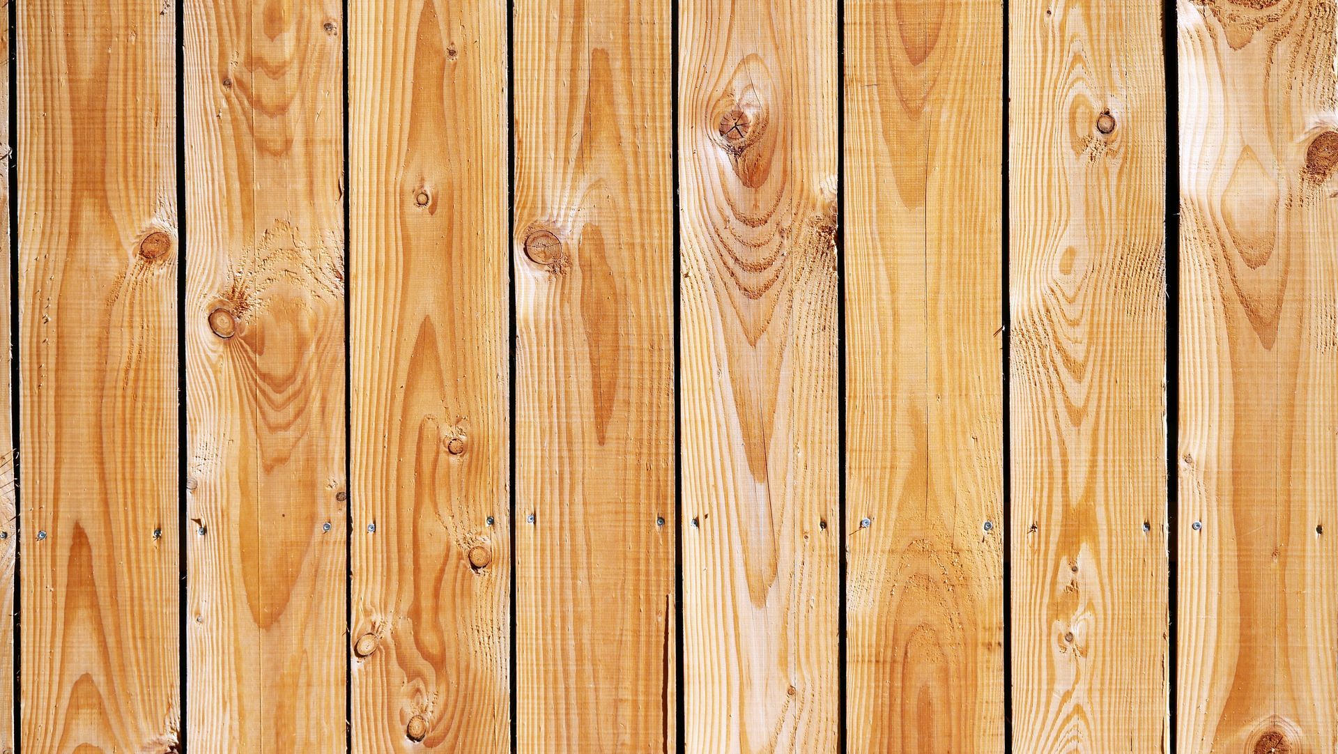 Close-up of natural and textured wood fencing supplies in Gainesville, GA