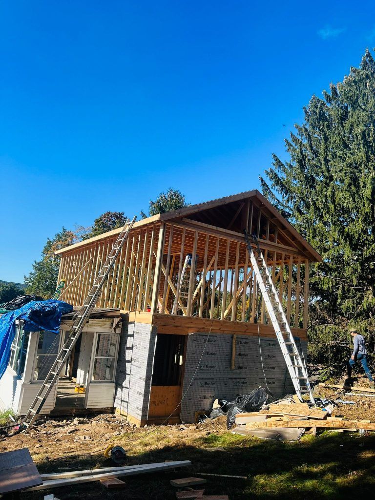 A house is being built in the middle of a forest.