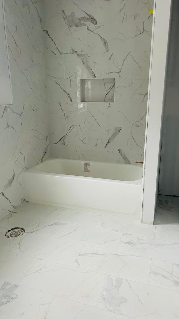 There is a bathtub in the middle of the bathroom.