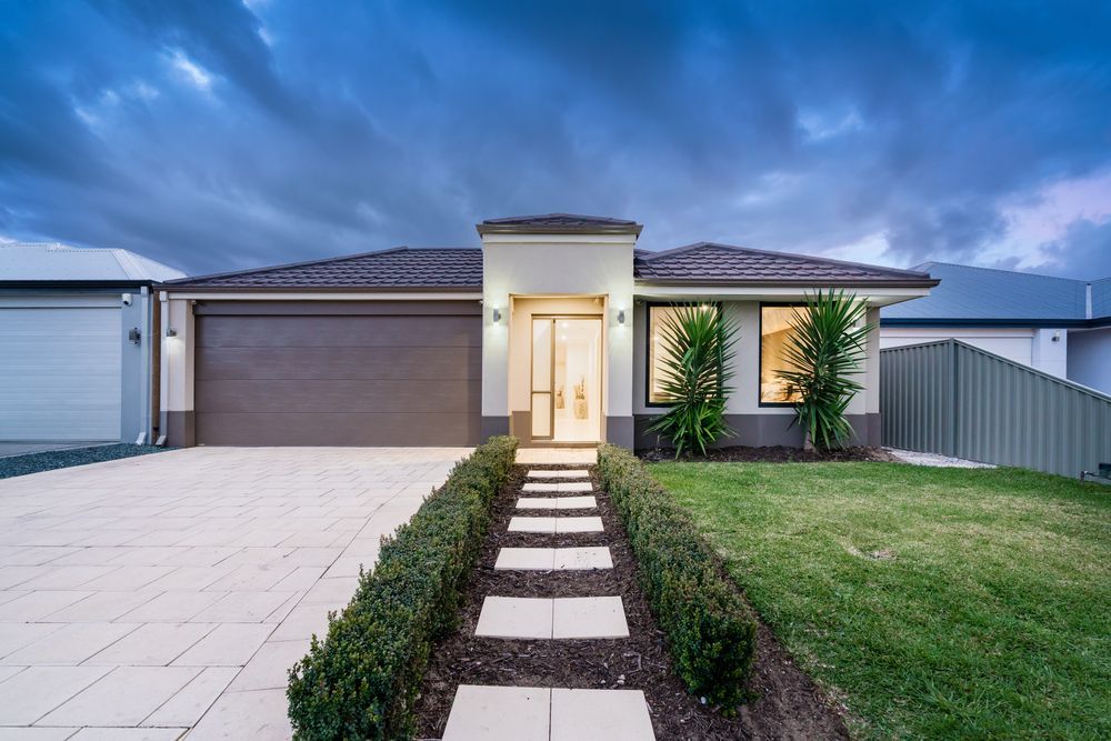 Modern White House With Wooden Walkway Leading to the Front Door — Nielsen Construction in Wagga Wagga, NSW