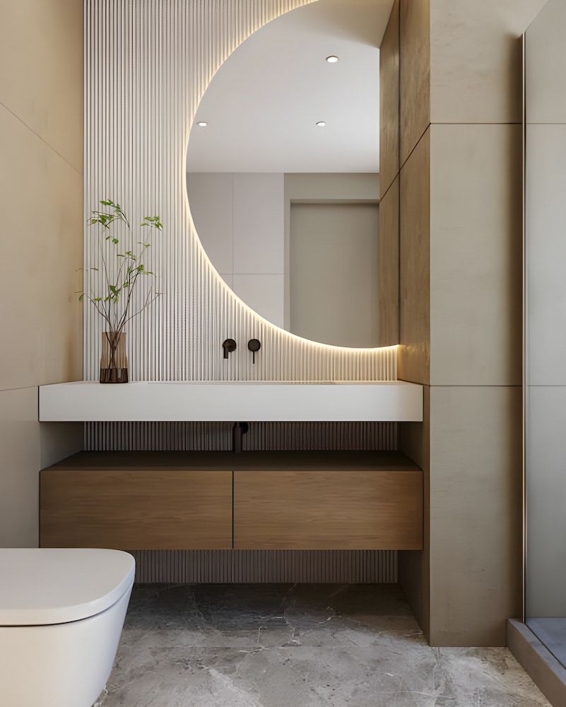 Modern Bathroom With a Round Mirror, Floating Vanity, and Wooden Drawers; Neutral Tones — Nielsen Construction in Wagga Wagga, NSW