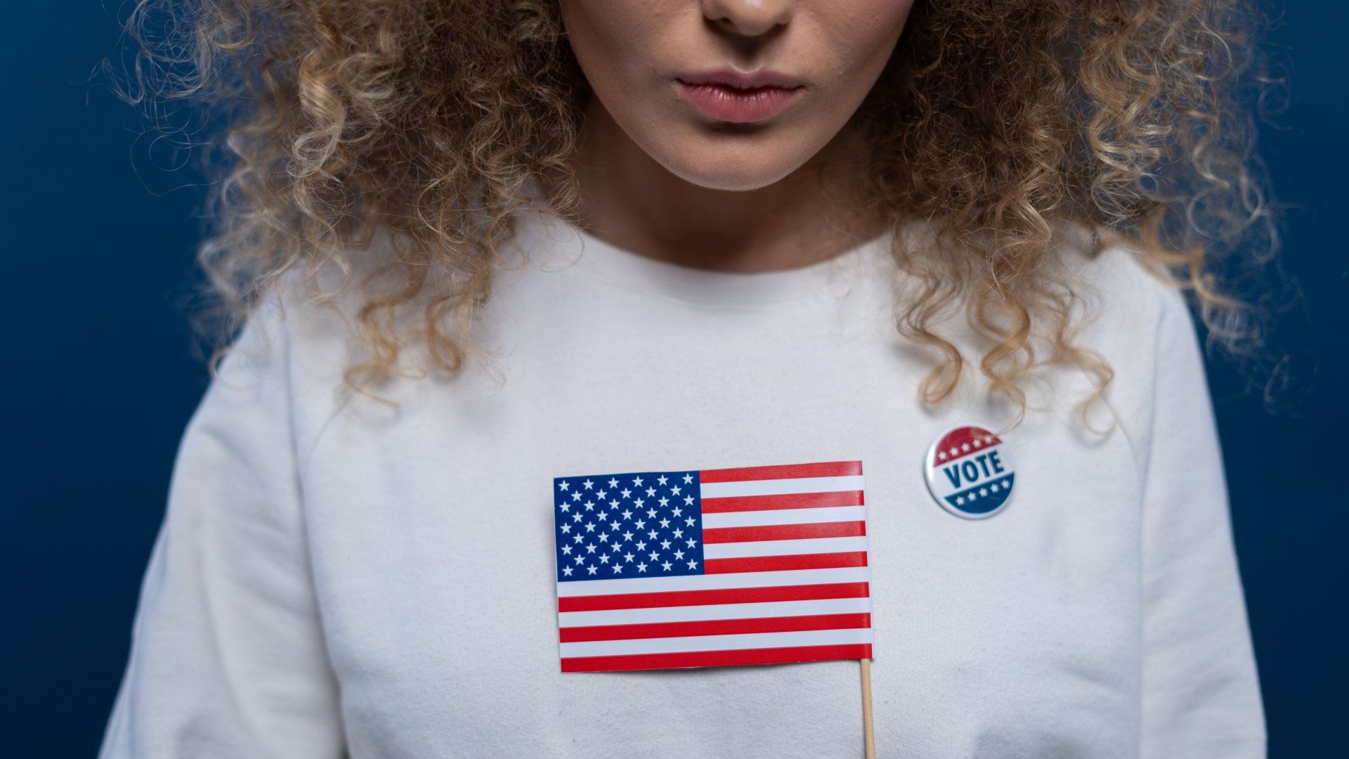 married woman holding an American flag