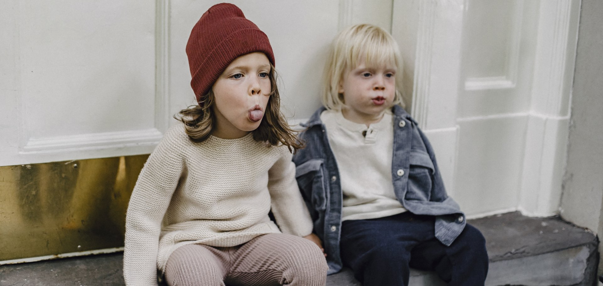 Step-children play outside of a home