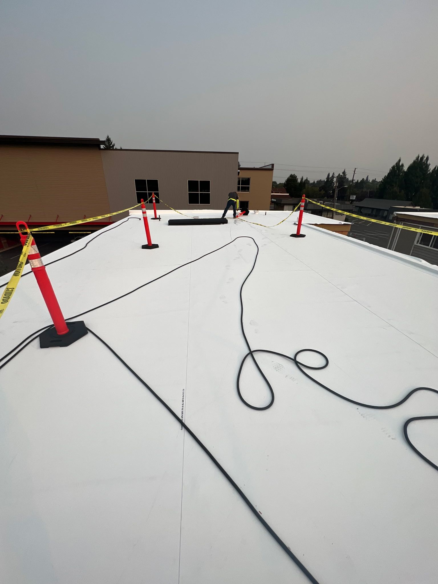 Before picture of a commercial roof in desperate need of a replacement