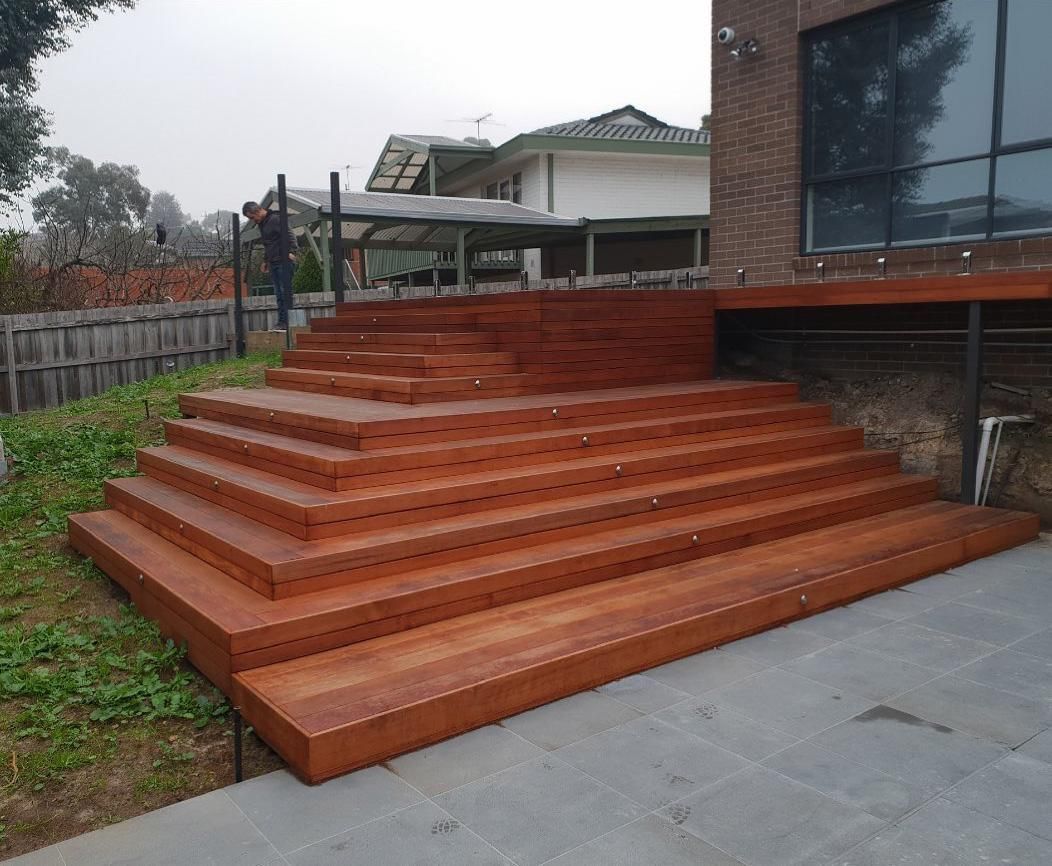 A Wooden Deck With Stairs Leading Up To It — All Aspects Landscaping In Peregian Beach, QLD