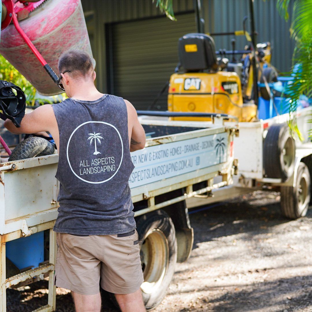 A Man Wearing A Tank Top With A Palm Tree On It — All Aspects Landscaping In Peregian Beach, QLD