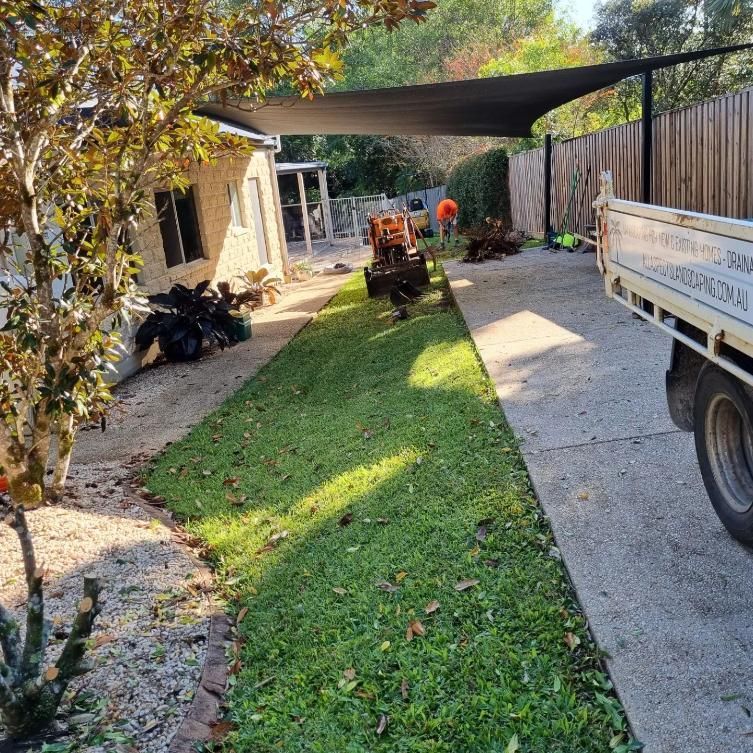 A Truck Is Parked In A Driveway Next To A House — All Aspects Landscaping In Peregian Springs, QLD