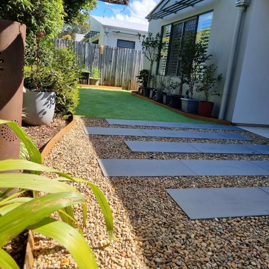 A Walkway Leading To A House With Gravel And Plants — All Aspects Landscaping In Peregian Beach, QLD