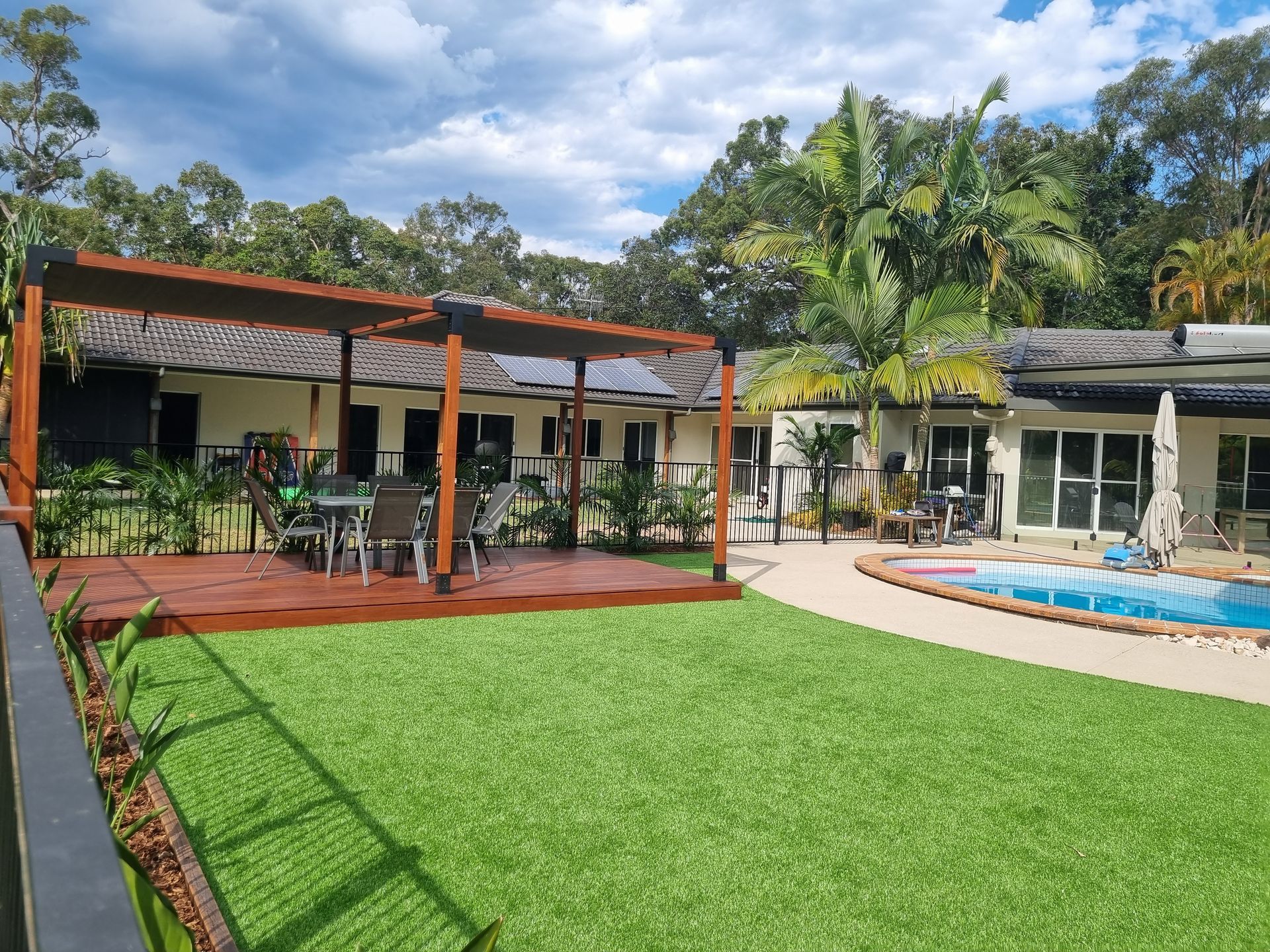Pergola in Backyard Of House Next To Pool — All Aspects Landscaping In Peregian Beach, QLD