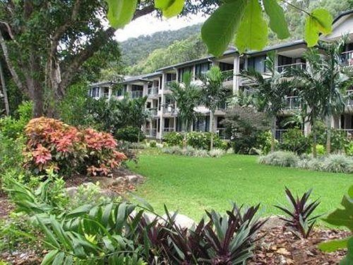 A Large Building With A Lush Green Lawn In Front Of It — All Aspects Landscaping In Peregian Beach, QLD