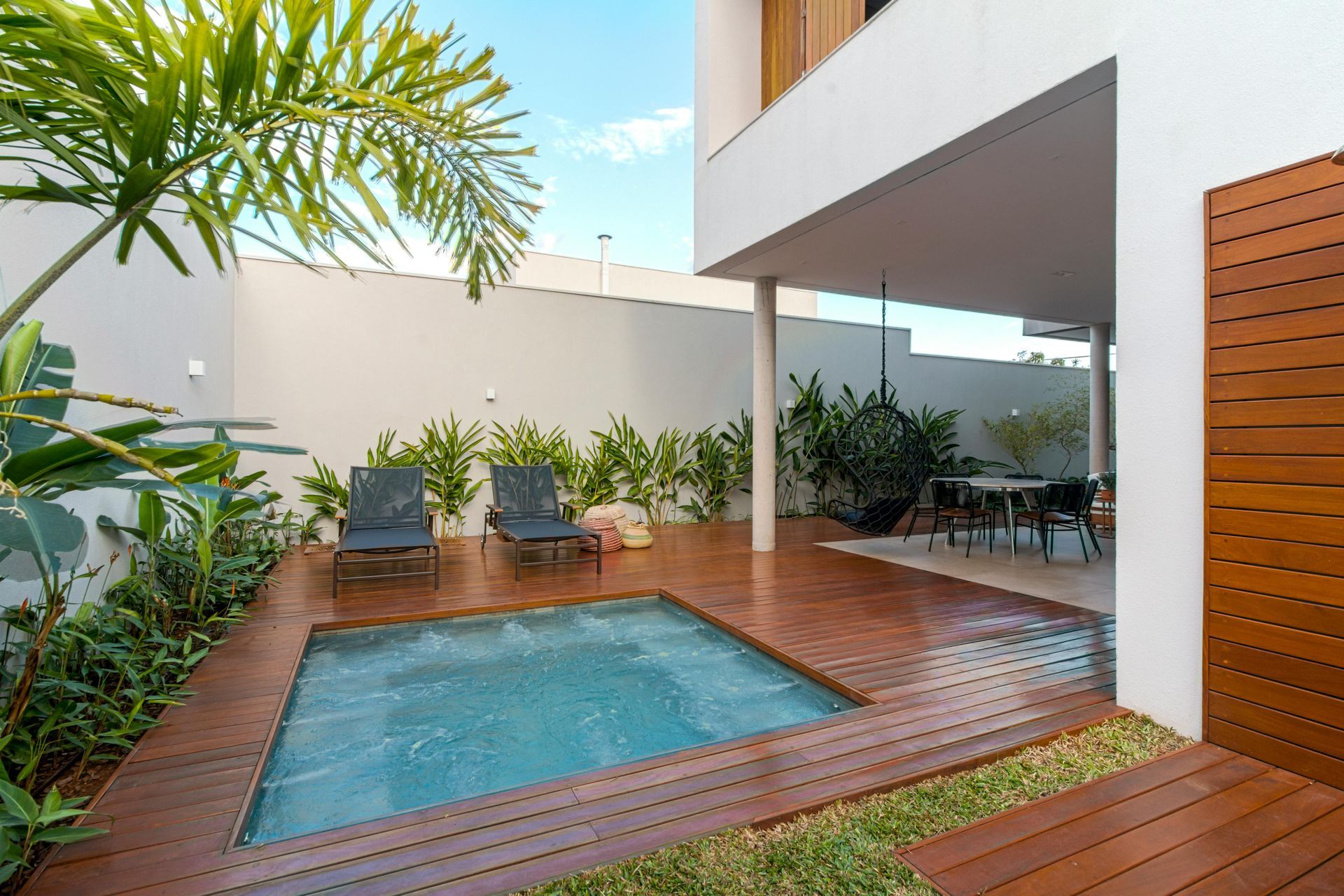 Patio With a Table and a Fire Pit in the Middle of It — All Aspects Landscaping In ﻿Coolum Beach, QLD