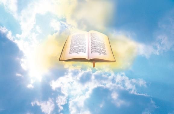 An open bible is floating in the sky.