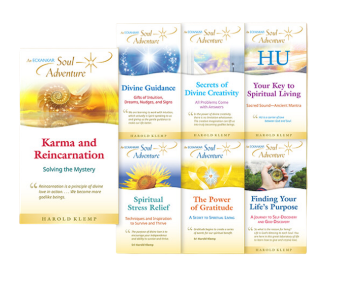 A collection of books about karma and reincarnation on a white background.