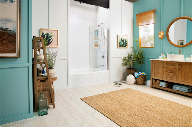 Bathroom with white walls, blue accents, wooden vanity, and a jute rug.